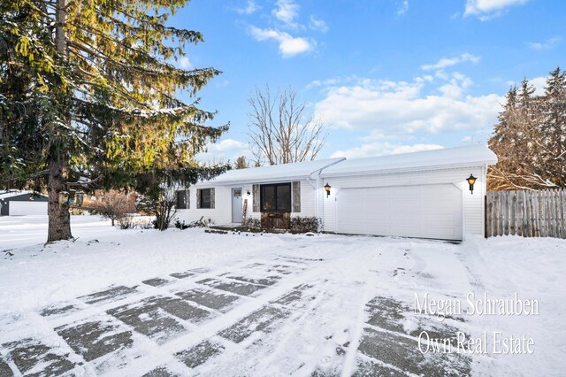 single story home featuring a garage