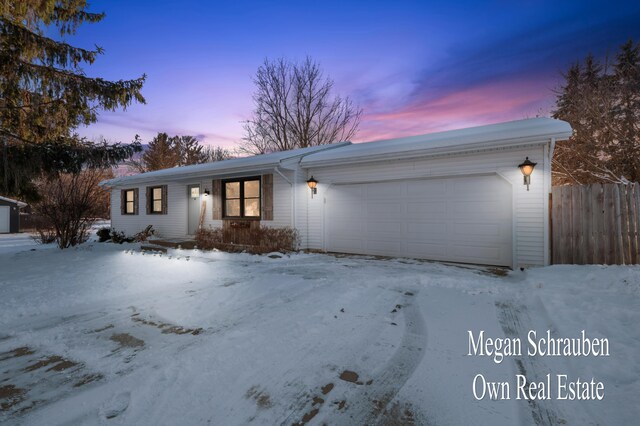 ranch-style house featuring a garage