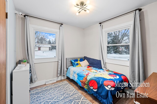 bedroom with hardwood / wood-style floors