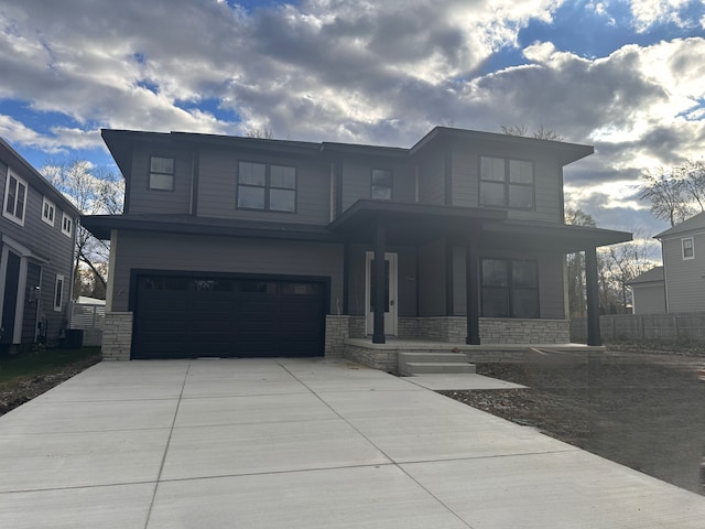 view of front of property featuring a garage and a porch