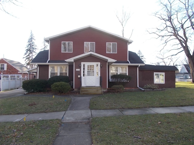 view of front of home with a front lawn