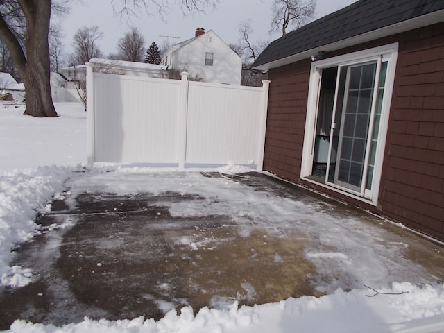 view of snow covered patio