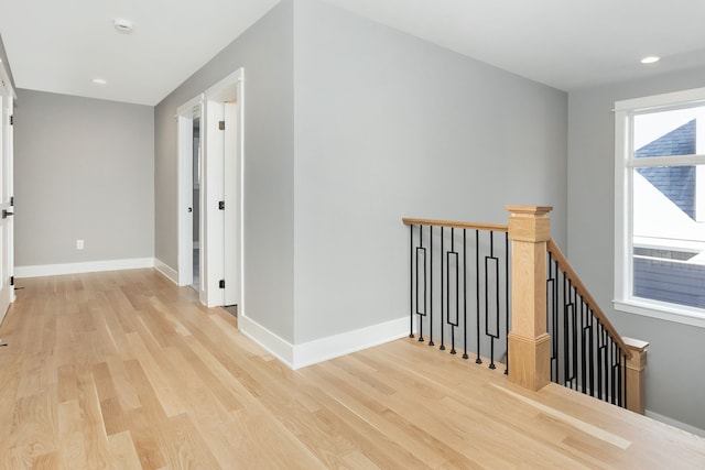 hall with light hardwood / wood-style floors