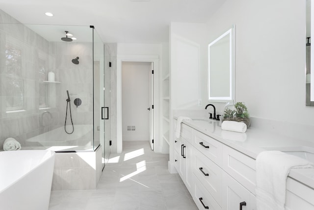 bathroom with plus walk in shower and vanity