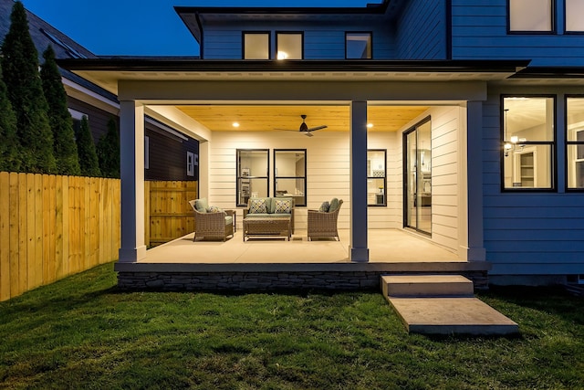 back of property with a patio and a lawn