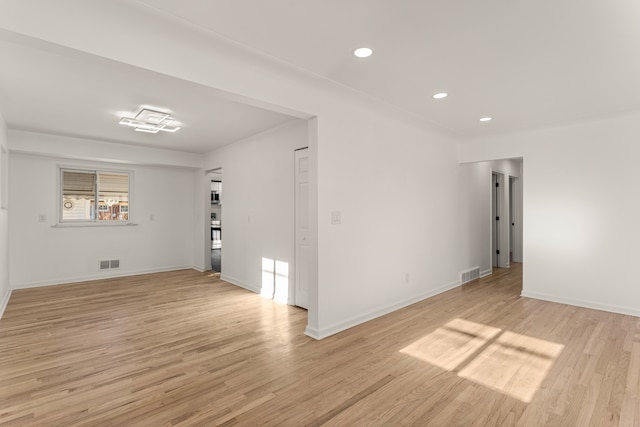 unfurnished room featuring light hardwood / wood-style floors