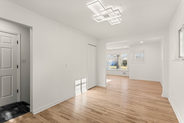 spare room with light wood-type flooring