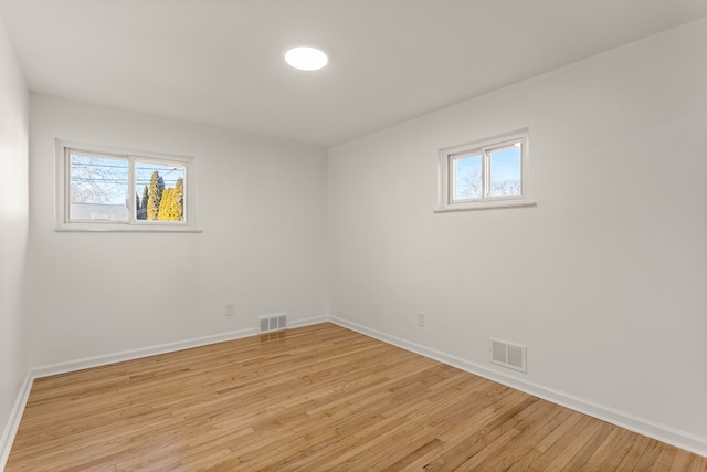 spare room featuring light hardwood / wood-style floors