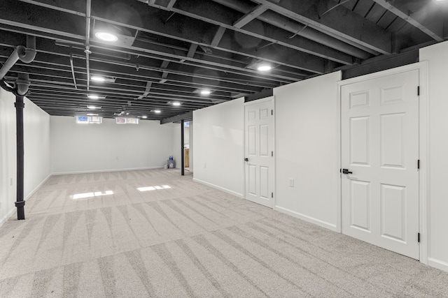 basement featuring carpet flooring