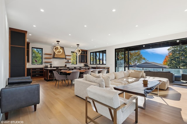 living room with a wealth of natural light and light wood-type flooring