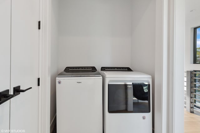 washroom featuring independent washer and dryer