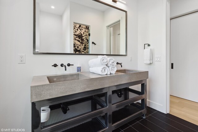 bathroom featuring vanity and hardwood / wood-style flooring