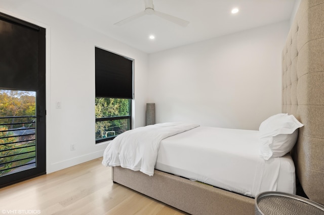 bedroom with light hardwood / wood-style floors and ceiling fan