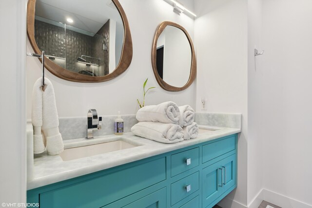 bathroom featuring vanity and walk in shower