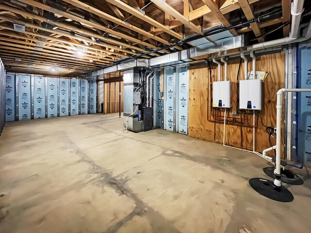 basement featuring heating unit and water heater