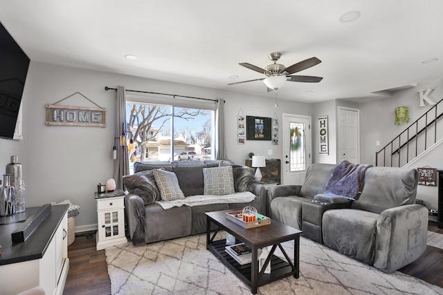 living room with light hardwood / wood-style floors and ceiling fan