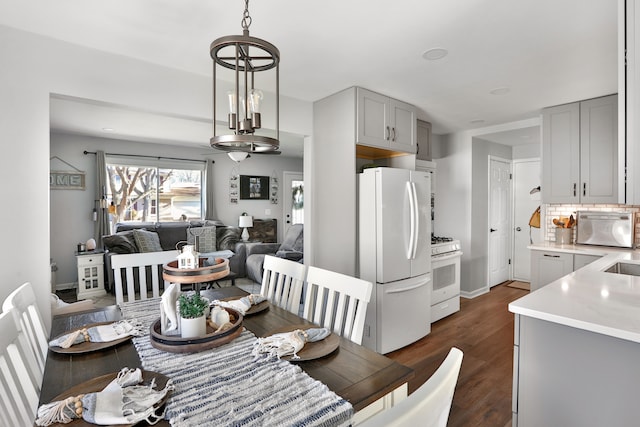 dining area featuring dark hardwood / wood-style flooring