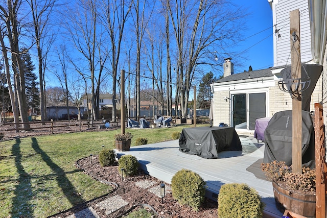 view of yard featuring a wooden deck