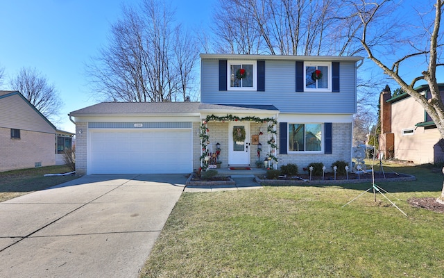 view of front facade featuring a garage and a front lawn