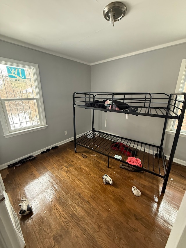 bedroom with hardwood / wood-style floors