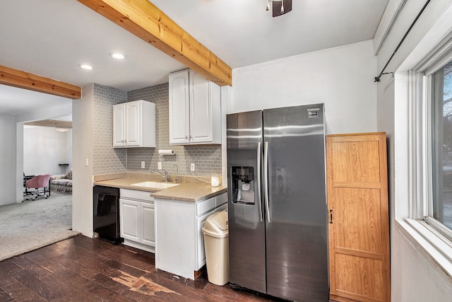 kitchen featuring dishwasher, stainless steel refrigerator with ice dispenser, sink, white cabinetry, and dark wood-type flooring