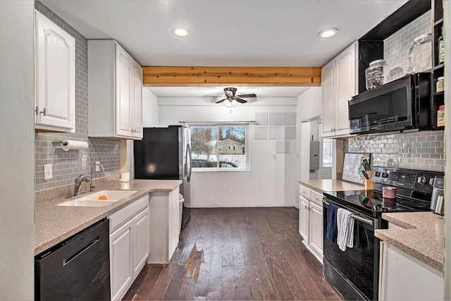 kitchen with decorative backsplash, black appliances, beam ceiling, white cabinets, and sink