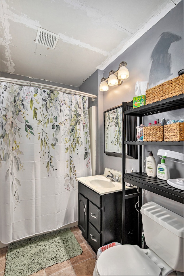 bathroom featuring toilet, a shower with curtain, and vanity