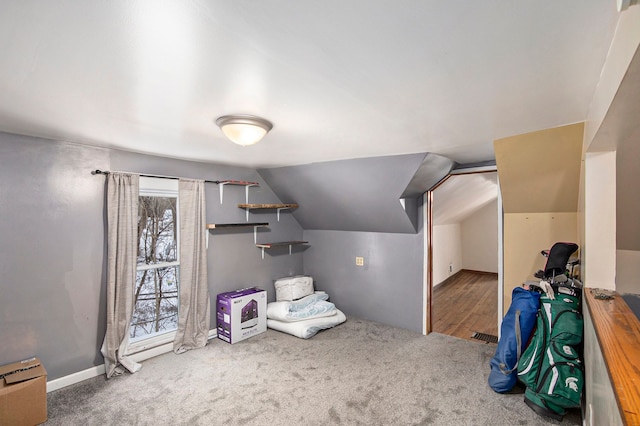 bonus room featuring baseboard heating, lofted ceiling, and carpet floors