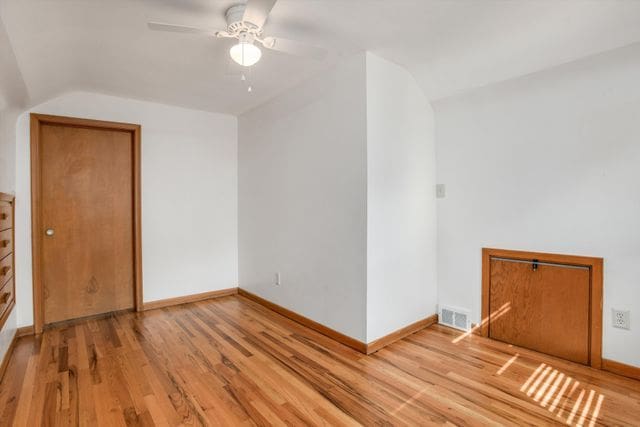 additional living space featuring lofted ceiling, ceiling fan, and hardwood / wood-style floors