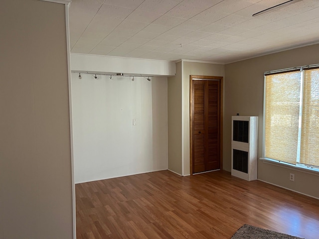 unfurnished bedroom with hardwood / wood-style flooring