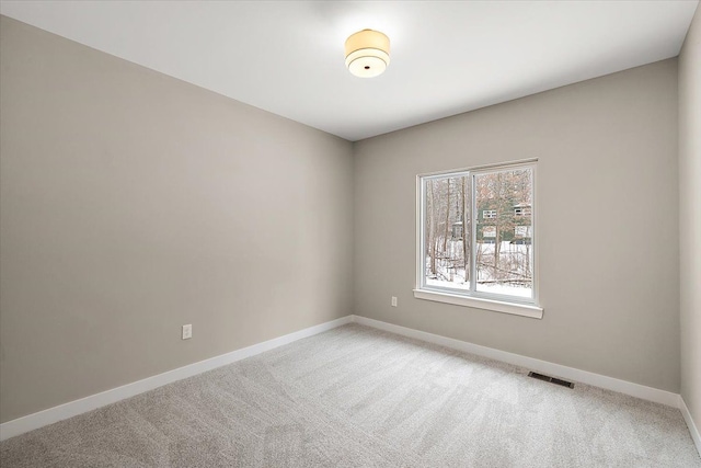 empty room featuring carpet floors