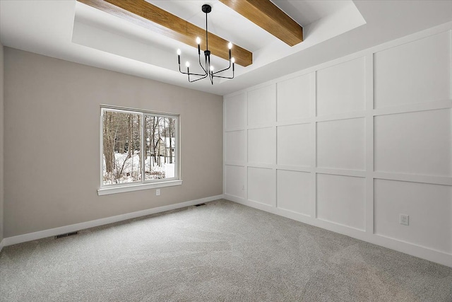 unfurnished room featuring light colored carpet, a raised ceiling, a chandelier, and beamed ceiling