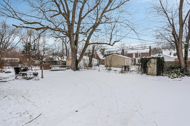 view of yard covered in snow