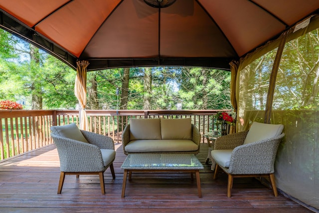 deck with a gazebo and an outdoor living space