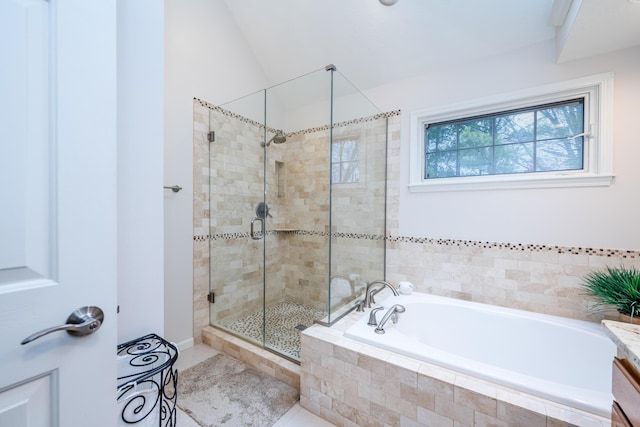 bathroom with vaulted ceiling, plus walk in shower, and vanity