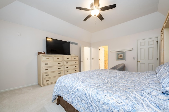 carpeted bedroom featuring ceiling fan, a raised ceiling, and lofted ceiling