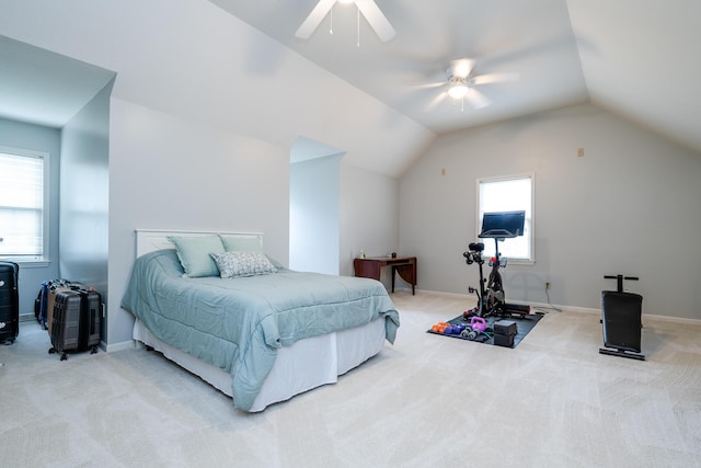 carpeted bedroom featuring ceiling fan and vaulted ceiling