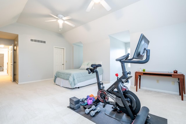 exercise area with vaulted ceiling, light colored carpet, and ceiling fan