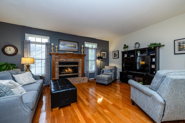 living room featuring a fireplace and hardwood / wood-style floors