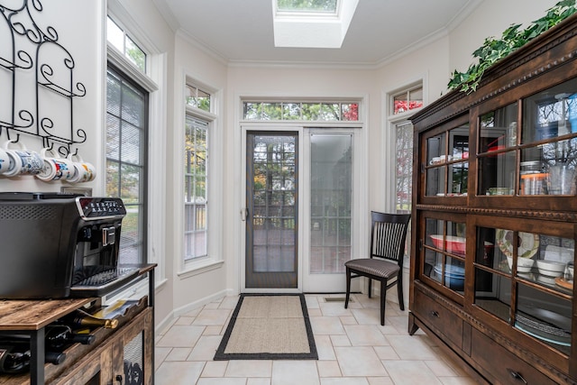 interior space with ornamental molding and a skylight