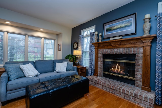 living room with a fireplace and hardwood / wood-style floors