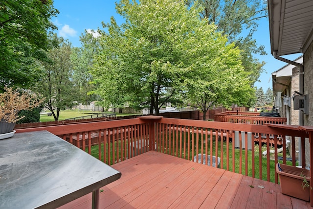 wooden terrace with a yard