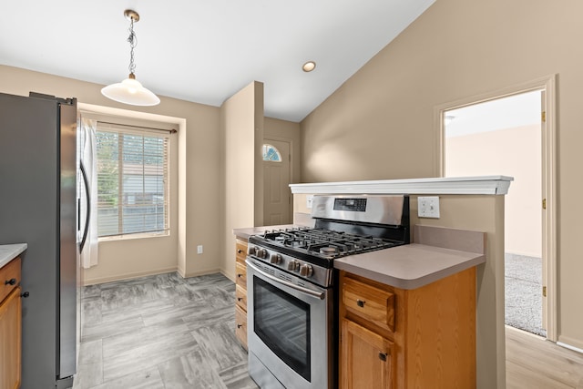 kitchen with stainless steel appliances, hanging light fixtures, and lofted ceiling