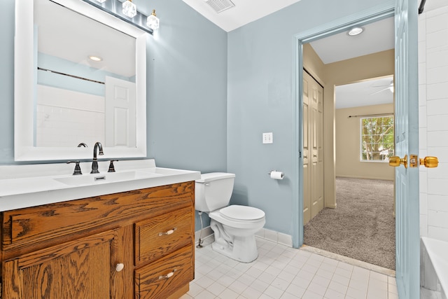 bathroom featuring vanity, toilet, and tile patterned flooring