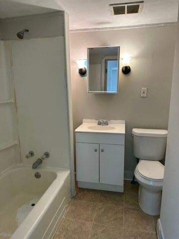 full bathroom with toilet, vanity, and shower / bath combination