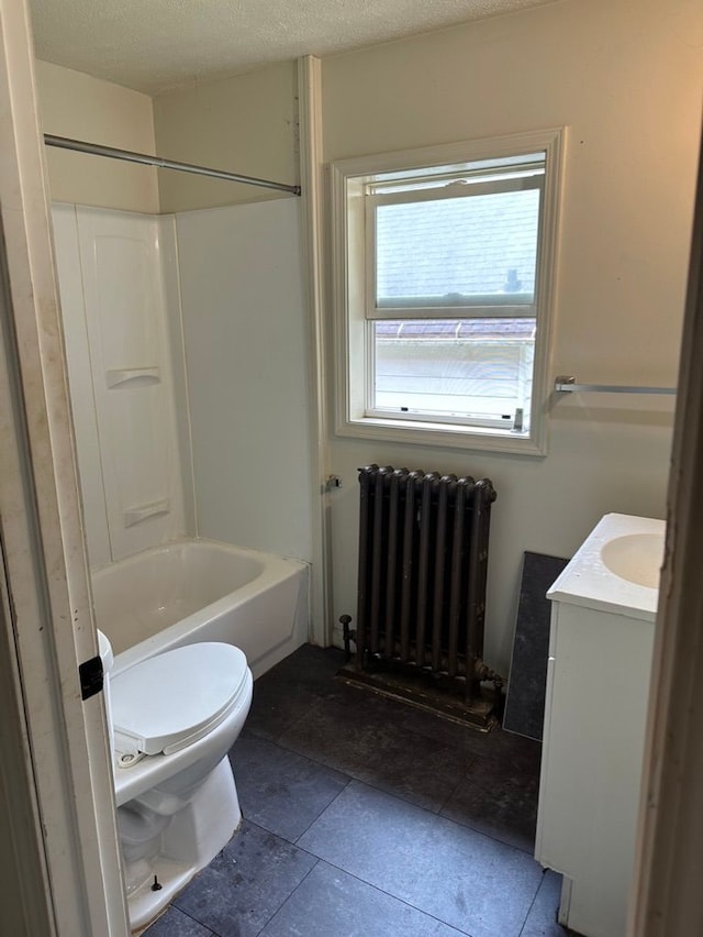 full bathroom featuring toilet, a textured ceiling, radiator, shower / bath combination, and vanity