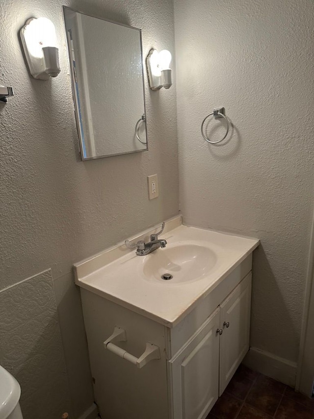 bathroom featuring tile patterned flooring and vanity