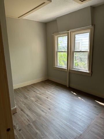 unfurnished room featuring light hardwood / wood-style floors