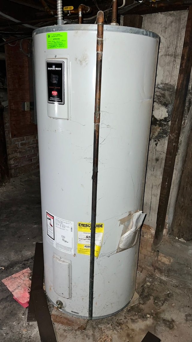 utility room with electric water heater