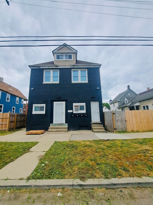 view of front of home with a front lawn